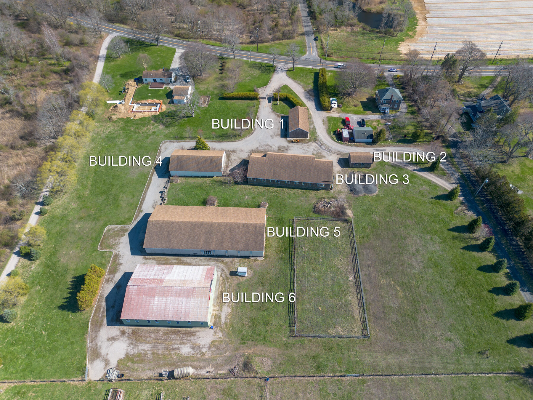Aerial showing all six buildings labeled across the property