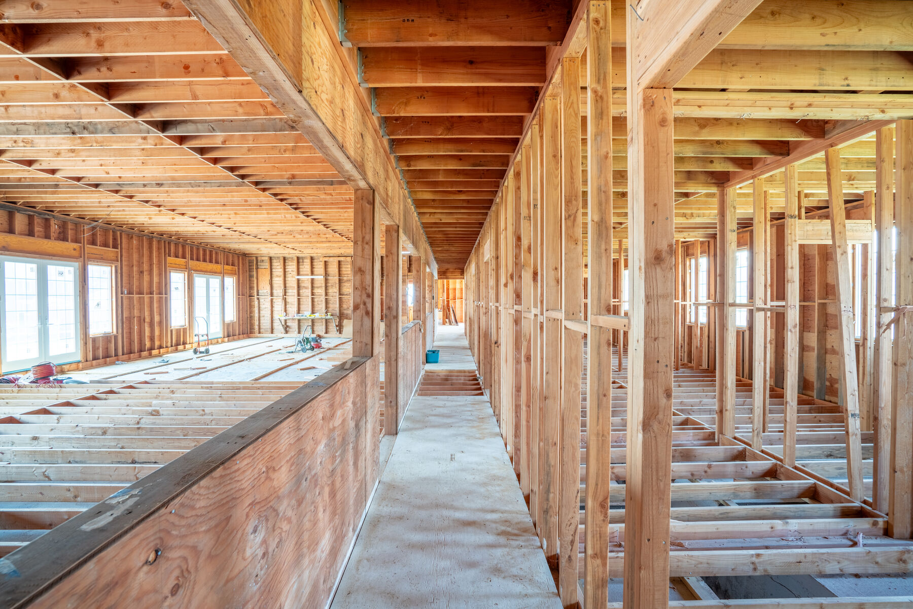 The renovated 4,578 sq ft multi-use barn — framed interior ready for residential conversion. Click to see the full gallery in a new tab.